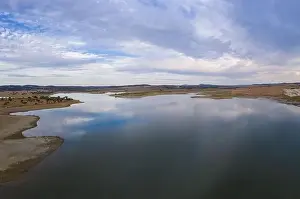 Reflection Lake Prints: Drone aerial panorama of a dam lake reservoir at sunset in Terena, Portugal