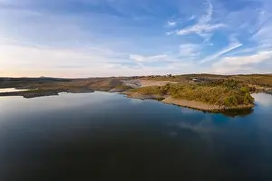 Reflection Lake Prints: Drone aerial panorama of a dam lake reservoir at sunset in Terena, Portugal