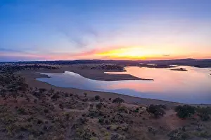 Reflection Lake Prints: Drone aerial panorama of a dam lake reservoir at sunset in Terena, Portugal