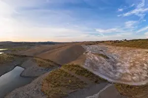 Reflection Lake Prints: Drone aerial panorama of a desert like hill landscape with marble stones dust at sunset in Terena