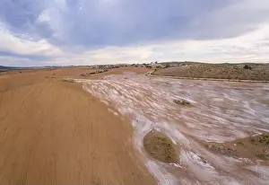Reflection Lake Prints: Drone aerial panorama of a desert like hill landscape with marble stones dust at sunset in Terena