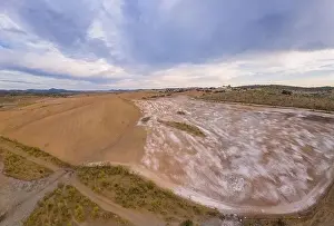 Reflection Lake Prints: Drone aerial panorama of a desert like hill landscape with marble stones dust at sunset in Terena