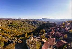 Sortelha Prints: Drone aerial panorama of historic village of Sortelha with castle and with turbines on natural landscape