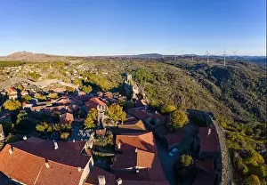 Sortelha Prints: Drone aerial panorama of historic village of Sortelha with castle and with turbines on natural landscape