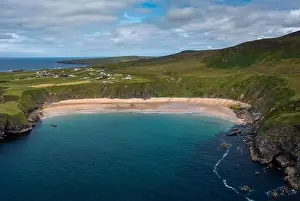 A drone aerial view of the beautiful Silver Strand and horseshoe bay at Malin Beg on the Wild Atlantic Way of Ireland