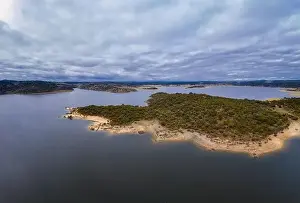 Carmona Prints: Drone aerial view of Idanha Dam Marechal Carmona landscape with beautiful blue lake water