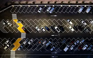 Free Space Prints: Drone aerial view of parking lots with cars at night
