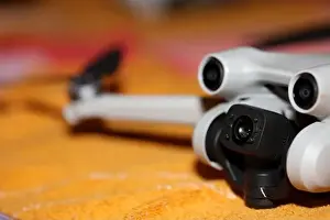 Piloting Prints: Drone with camera isolated on table close up colorful background modern aerial high quality big size instant prints