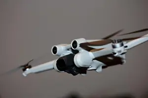 Piloting Prints: The drone copter flying with digital camera isolated on empty colorful background grey drones quad with sensors fly