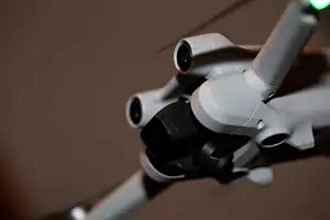 Piloting Prints: The drone copter flying with digital camera isolated on empty colorful background grey drones quad with sensors fly