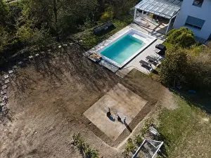 Common Duckweed Prints: Drone flight over fresh earth area with grass grown next to pool construction site in April
