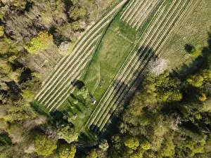 Drone flight over green meadows, forests, landscape, nature in April in Austria