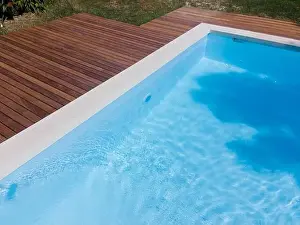 Above View Prints: Drone flight over pool with nice wooden terrace surrounded by green lawn in beautiful garden