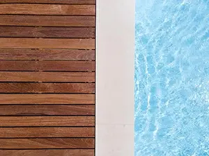 Above View Prints: Drone flight over pool with nice wooden terrace surrounded by green lawn in beautiful garden