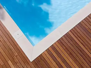 Above View Prints: Drone flight over pool with nice wooden terrace surrounded by green lawn in beautiful garden