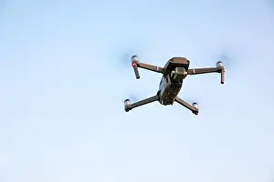 Drone flying over landscape. UAV drone copter flying with digital camera