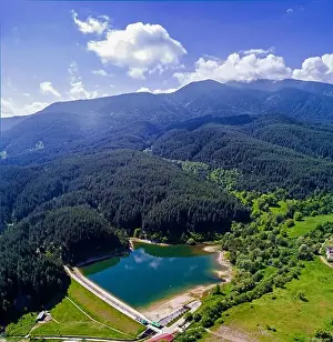Winter Sport Prints: drone image. aerial view of rural area with fields and forest lake