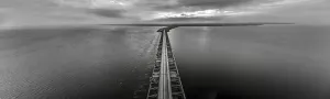 Hydro Prints: Drone image over the Haringvlietdam flood barrier near the Dutch town of Ouddorp against a cloudy morning sky
