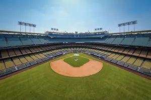 Drone images of Dodger Stadium with the Los Angeles skyline visible in a few shots