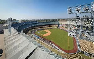 Drone images of Dodger Stadium with the Los Angeles skyline visible in a few shots