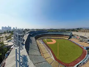 Drone images of Dodger Stadium with the Los Angeles skyline visible in a few shots