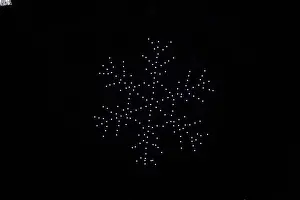 Arranged Prints: A drone lightshow arranged in the shape of a snowflake