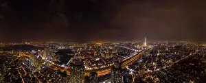 Thau Prints: Drone panorama of Ho Chi Minh City at night from Thao Dien showing the suburban sprawl of the city
