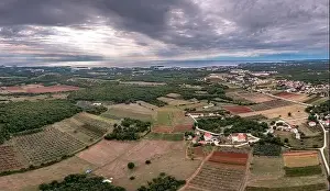 Porec Prints: Drone panorama over Istrian Adriatic coast near Porec taken from high altitude during daytime with cloudy sky