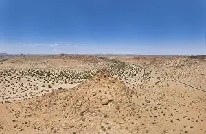 Petroglyph Prints: Drone panorama over the Namibian desert landscape near Twyfelfontein during the day in summer