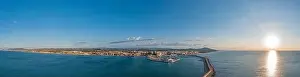 Vinaros Prints: Drone panorama of the Spanish town of Vinaros with the large breakwater at the entrance to the port during sunrise