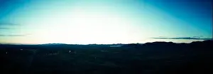 Sunset Landscape Prints: Drone panorama of a sunset over the Sonoran desert of Arizona in blue tones with partly cloudy skies