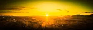 Sunset Landscape Prints: Drone panorama of a sunset over the Sonoran desert of Arizona with partly cloudy skies