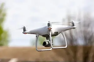 Videography Prints: Drone quadrocopter with high resolution digital camera on the sky background