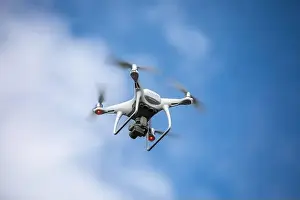 Videography Prints: Drone quadrocopter with high resolution digital camera on the sky background