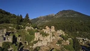 Peloponnese Prints: Drone shot, Historical ruins in a hilly landscape with a clear blue sky
