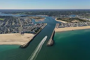 New Jersey Prints: A drone shot of a ship passing through the Manasquan Inlet in New Jersey on a bright sunny day