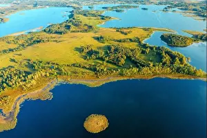Bold Colors Prints: Drone View. Amazing Scenic Aerial Bright Sunbeams View Green Meadow And River Landscape In Sunny Spring Day