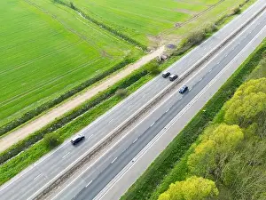 Intercity Prints: Drone view of part of anEnglish dual carriage way shown in the East Anglian countryside