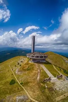 Drone top view Buzludzha - abandoned communist building in the Balkan mountains, Bulgaria. UFO dish look a like
