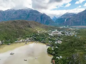 Drone view of Caleta Tortel with its small cabins - Discovering the beautiful village while traveling the Carretera