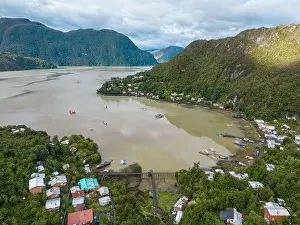 Drone view of Caleta Tortel with its small cabins - Discovering the beautiful village while traveling the Carretera