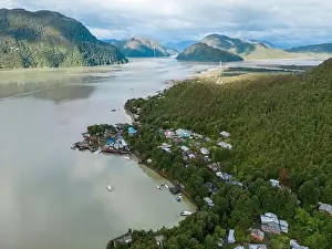 Drone view of Caleta Tortel with its small cabins - Discovering the beautiful village while traveling the Carretera