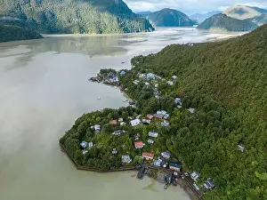 Drone view of Caleta Tortel with its small cabins - Discovering the beautiful village while traveling the Carretera