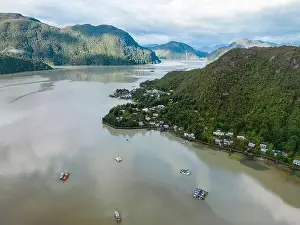 Drone view of Caleta Tortel with its small cabins - Discovering the beautiful village while traveling the Carretera