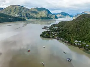 Drone view of Caleta Tortel with its small cabins - Discovering the beautiful village while traveling the Carretera