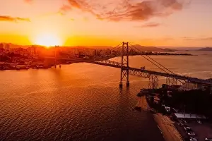 Santa Catarina Prints: Drone view of city and Hercilio luz bridge with sunset in Florianopolis, Brazil