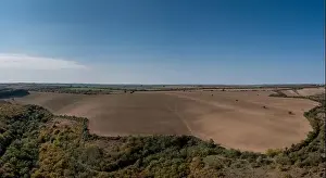 Plowed Prints: Drone view of endless brown plowed agricultural fields on the Danubian Plain of Bulgaria