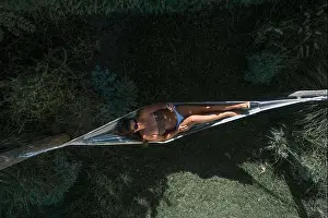 Satisfied Prints: From above drone view of female in bikini