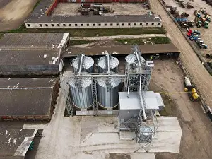 Top Down Prints: Drone view of grain elevator complex with silos