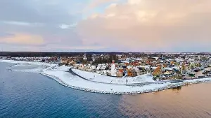 Water Tourism Prints: Drone view of the Lighthouse of Urk during winter with snow landscape in the Netherlands